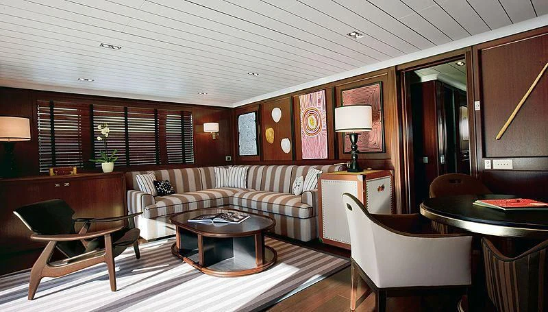 a living room with a couch and a coffee table aboard GALILEO Yacht for Sale
