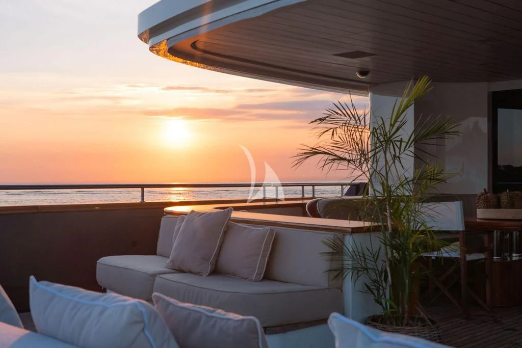 a large patio with a large body of water and a tree aboard GALILEO Yacht for Sale