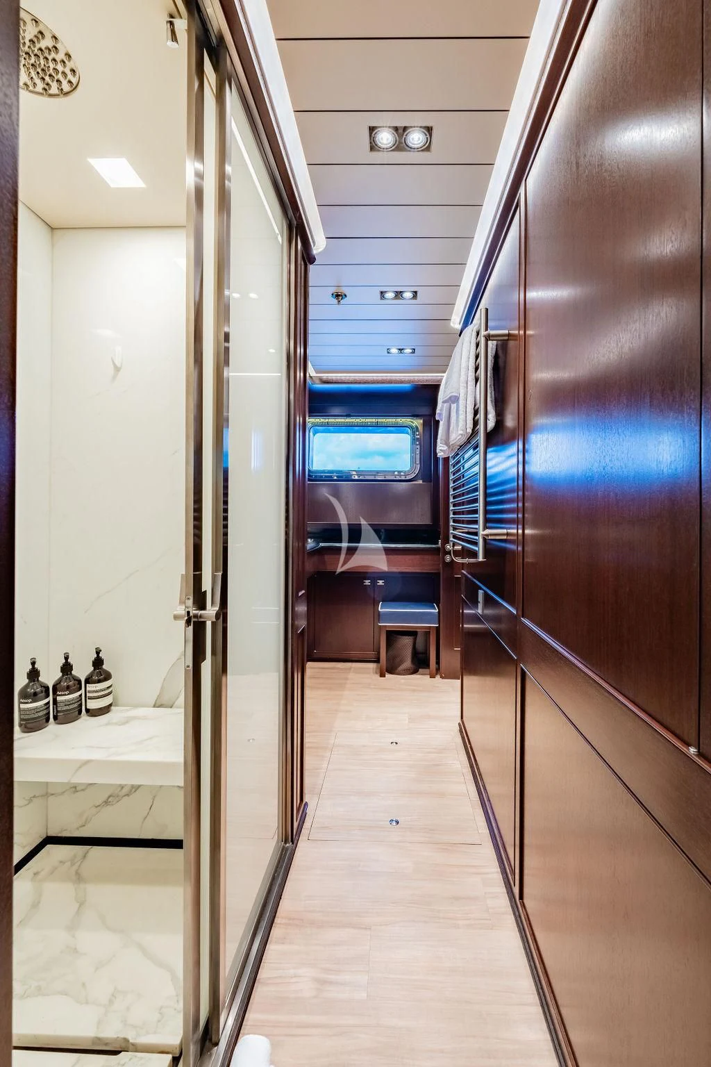 a hallway with a table and chairs aboard GALILEO Yacht for Sale