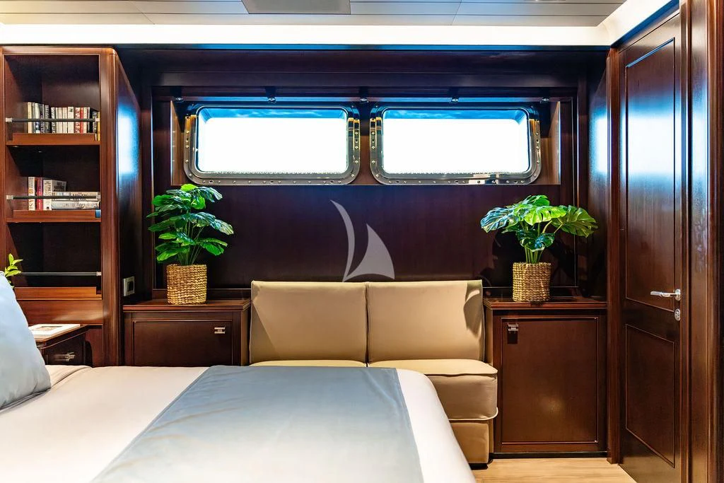 a room with a bed and a desk aboard GALILEO Yacht for Sale