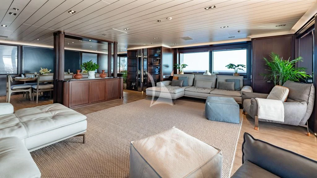 a living room with a large window aboard GALILEO Yacht for Sale