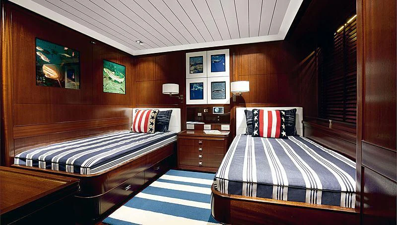 a room with a bed and a desk aboard GALILEO Yacht for Sale