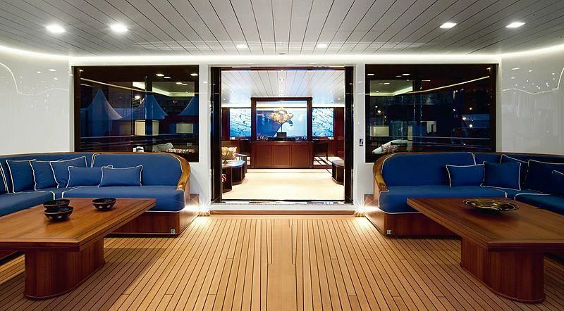 a room with a wood floor and a wood floor and a large window aboard GALILEO Yacht for Sale