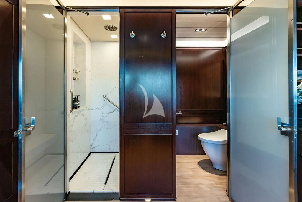 a bathroom with a glass door aboard GALILEO Yacht for Sale