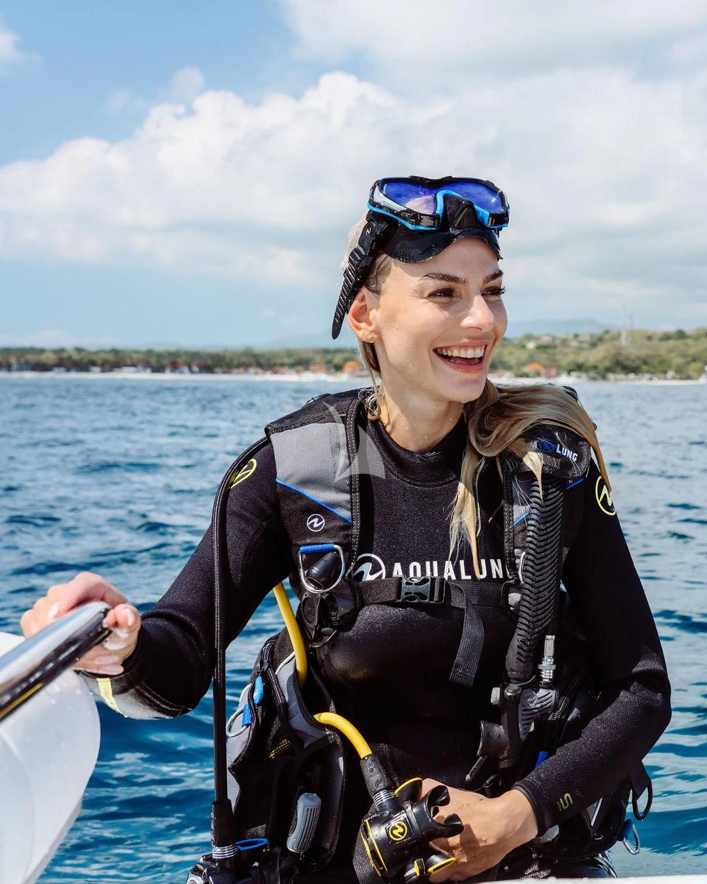 a person wearing a life jacket and sunglasses on a boat aboard GALILEO Yacht for Sale