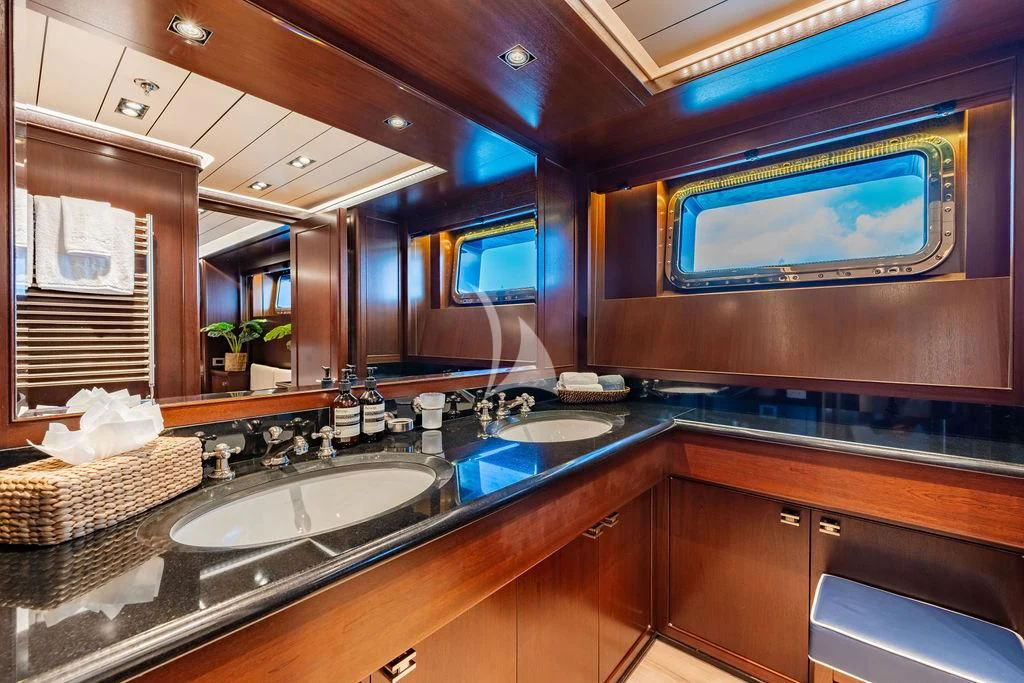 a bathroom with a large tv aboard GALILEO Yacht for Sale