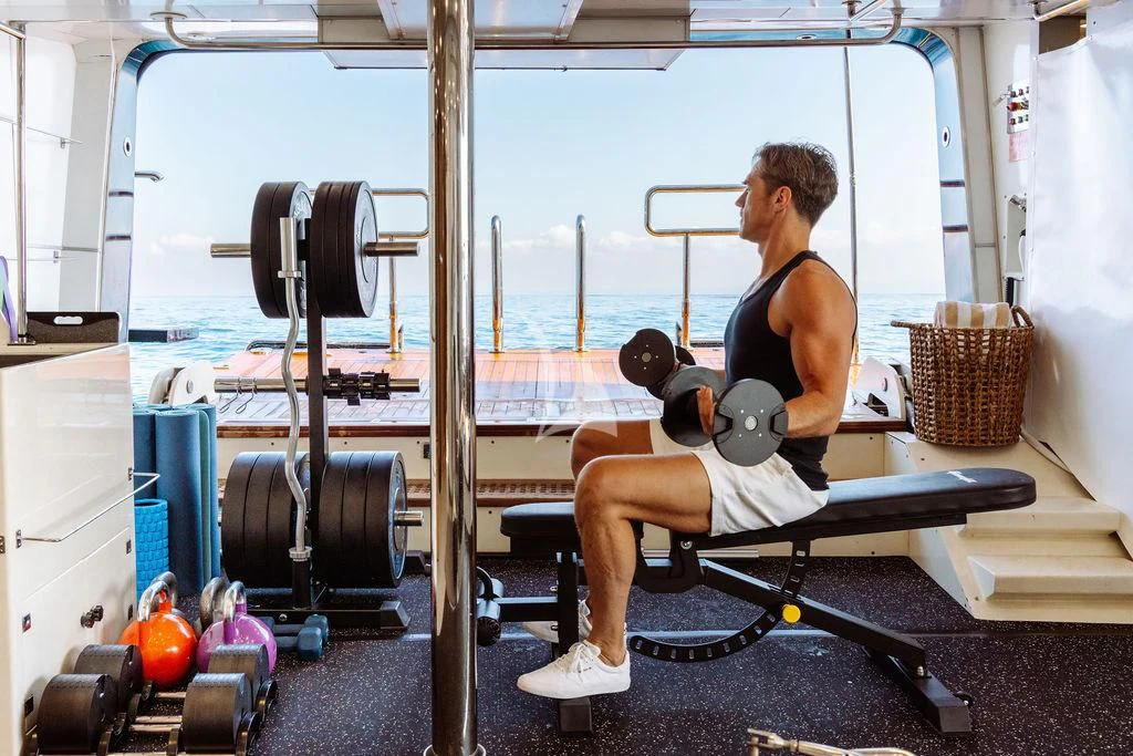 a person working out in a gym aboard GALILEO Yacht for Sale