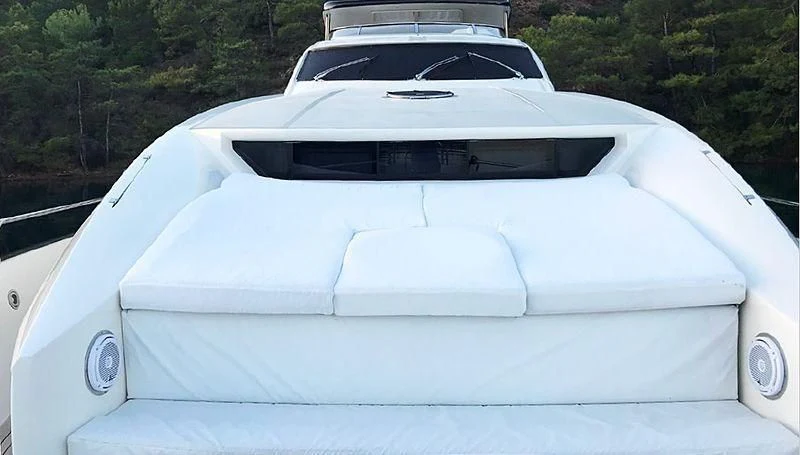 a white car with a black roof aboard NATALIA Yacht for Sale