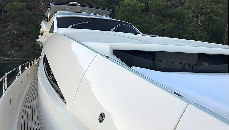 a white car on a road aboard NATALIA Yacht for Sale