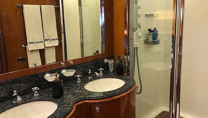a bathroom with a sink and a mirror aboard NATALIA Yacht for Sale