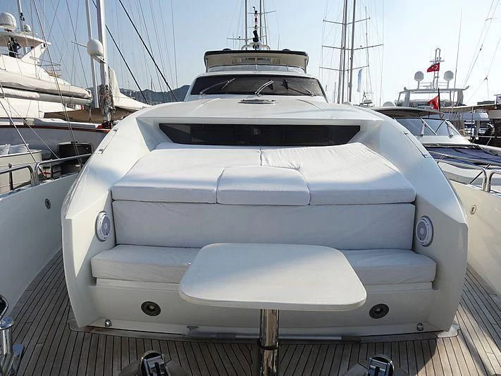 a white yacht on a deck aboard NATALIA Yacht for Sale