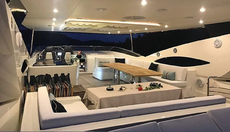a room with a large white desk and a large white chair aboard NATALIA Yacht for Sale