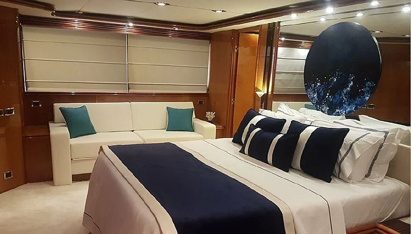 a room with beds and a large black balloon in the back aboard NATALIA Yacht for Sale