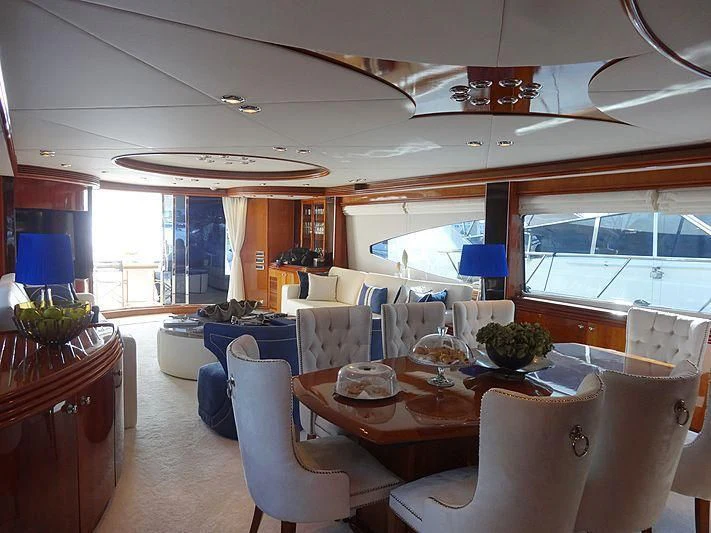 a dining room with a table and chairs aboard NATALIA Yacht for Sale