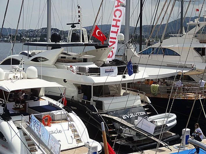 several boats are parked in a harbor aboard NATALIA Yacht for Sale