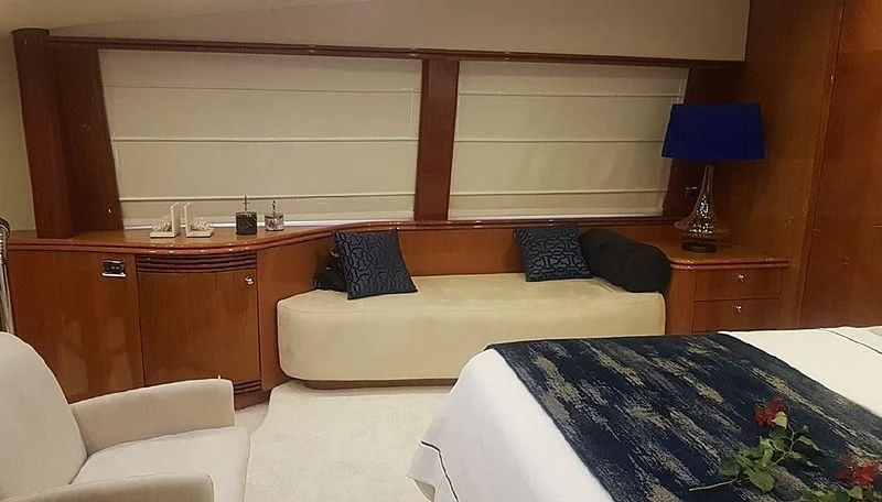 a room with a bed and a desk aboard NATALIA Yacht for Sale