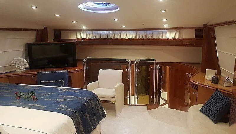 a room with a table and chairs aboard NATALIA Yacht for Sale