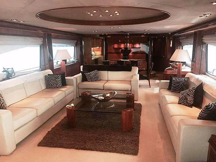 a living room with a large sofa aboard NATALIA Yacht for Sale
