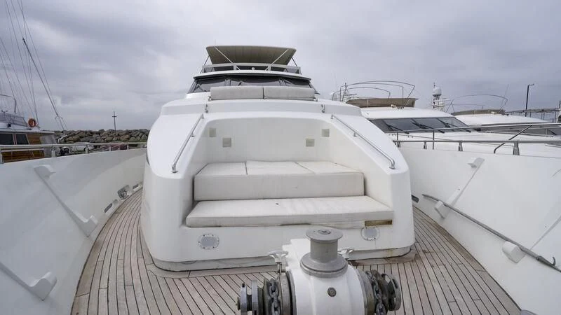 a white boat on a deck aboard NEWAL Yacht for Sale