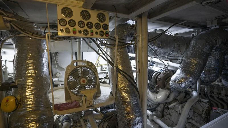 a large room with pipes and machinery aboard NEWAL Yacht for Sale