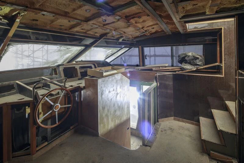 a room with a large window and a large metal object aboard NEWAL Yacht for Sale