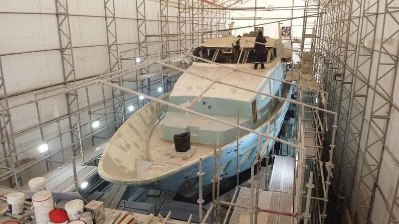 a boat in a large room aboard NEWAL Yacht for Sale
