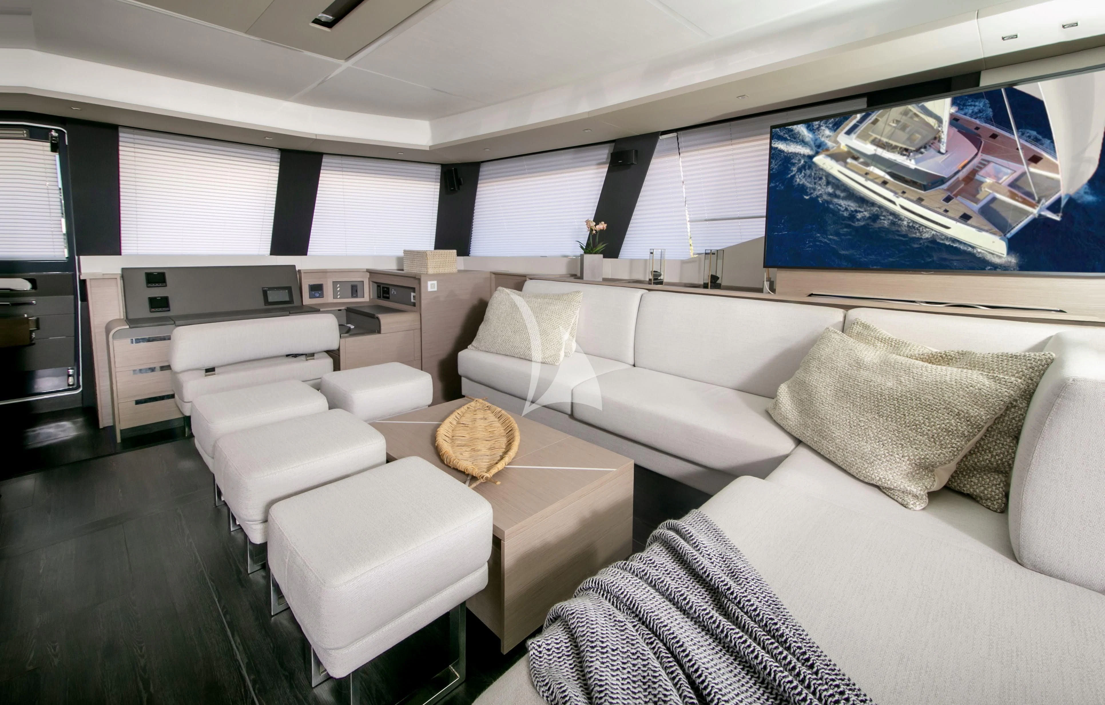 a room with a couch and a table aboard ALOIA Yacht for Charter