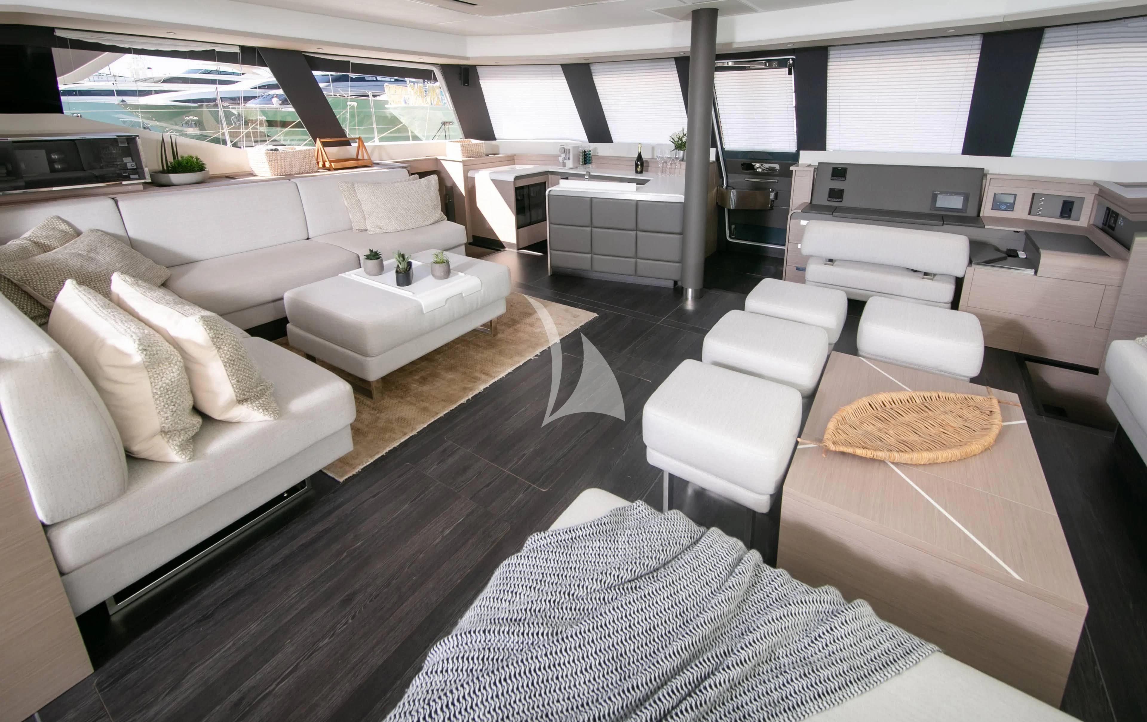a room with a couch and a table aboard ALOIA Yacht for Charter