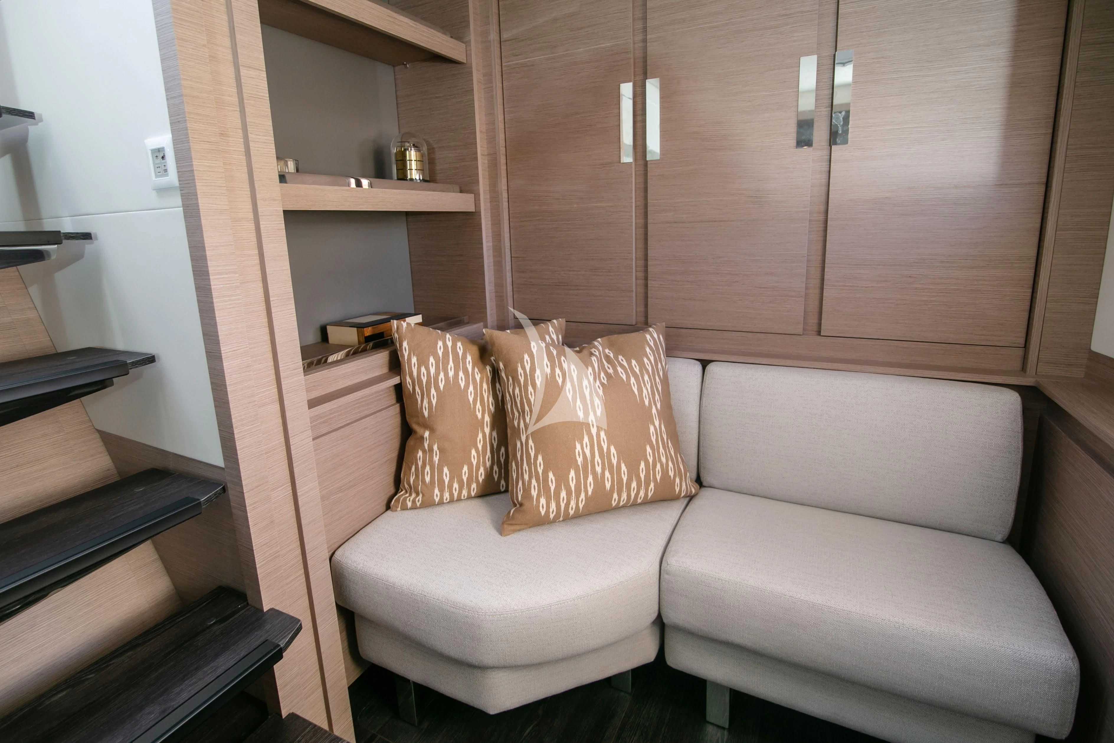 a couch in a room aboard ALOIA Yacht for Charter
