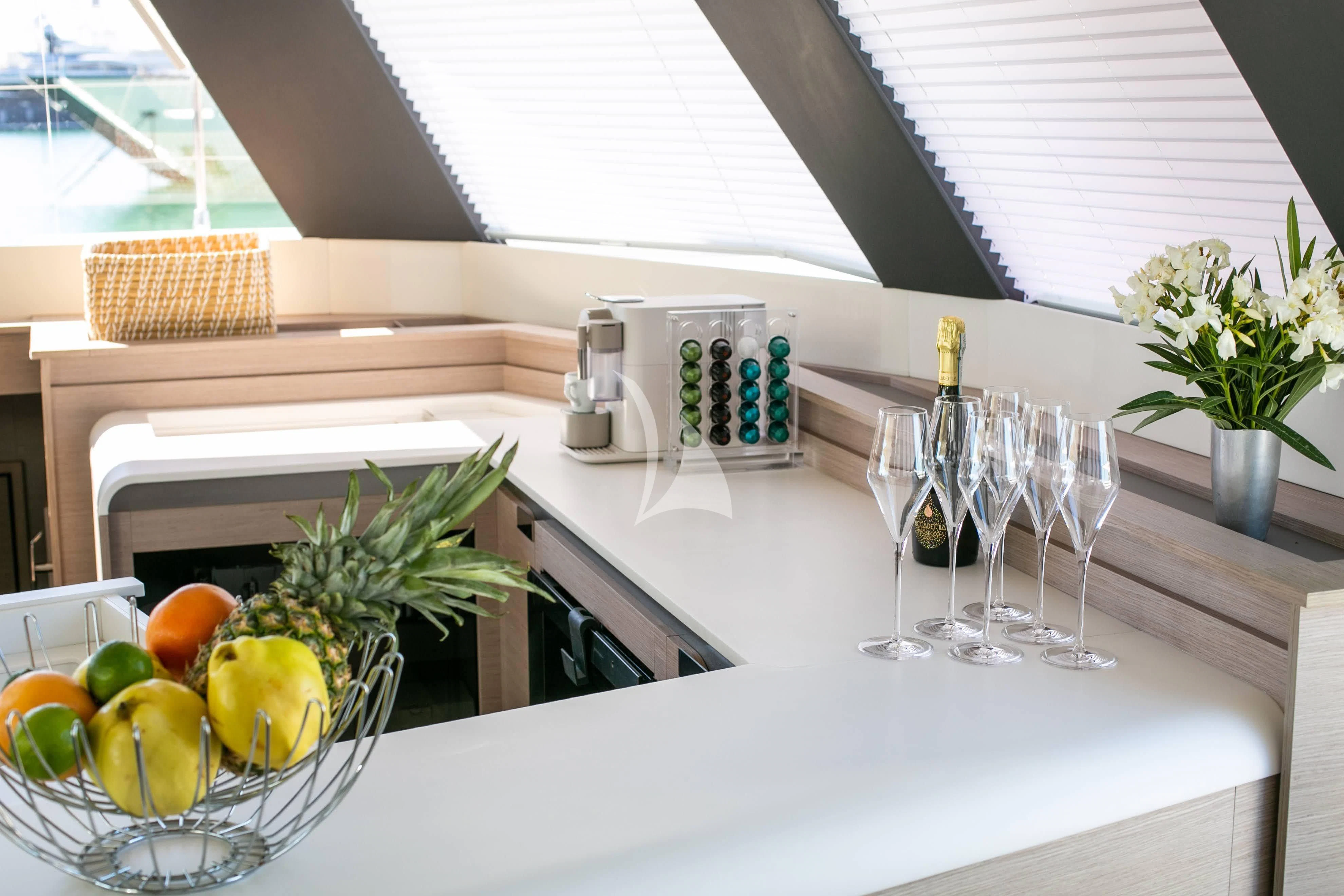 a kitchen with a white countertop aboard ALOIA Yacht for Charter