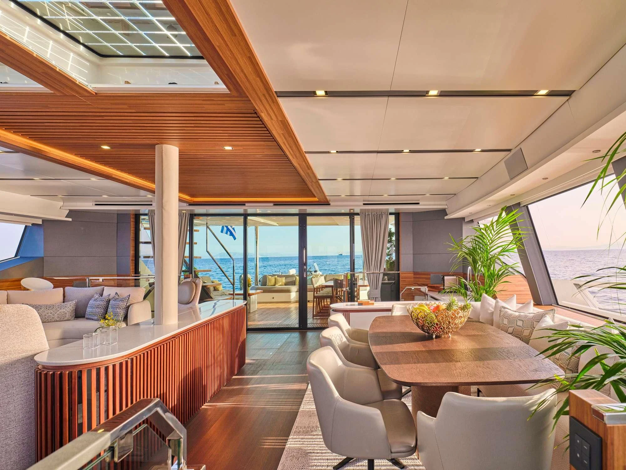 a room with a table and chairs aboard ALOIA Yacht for Charter
