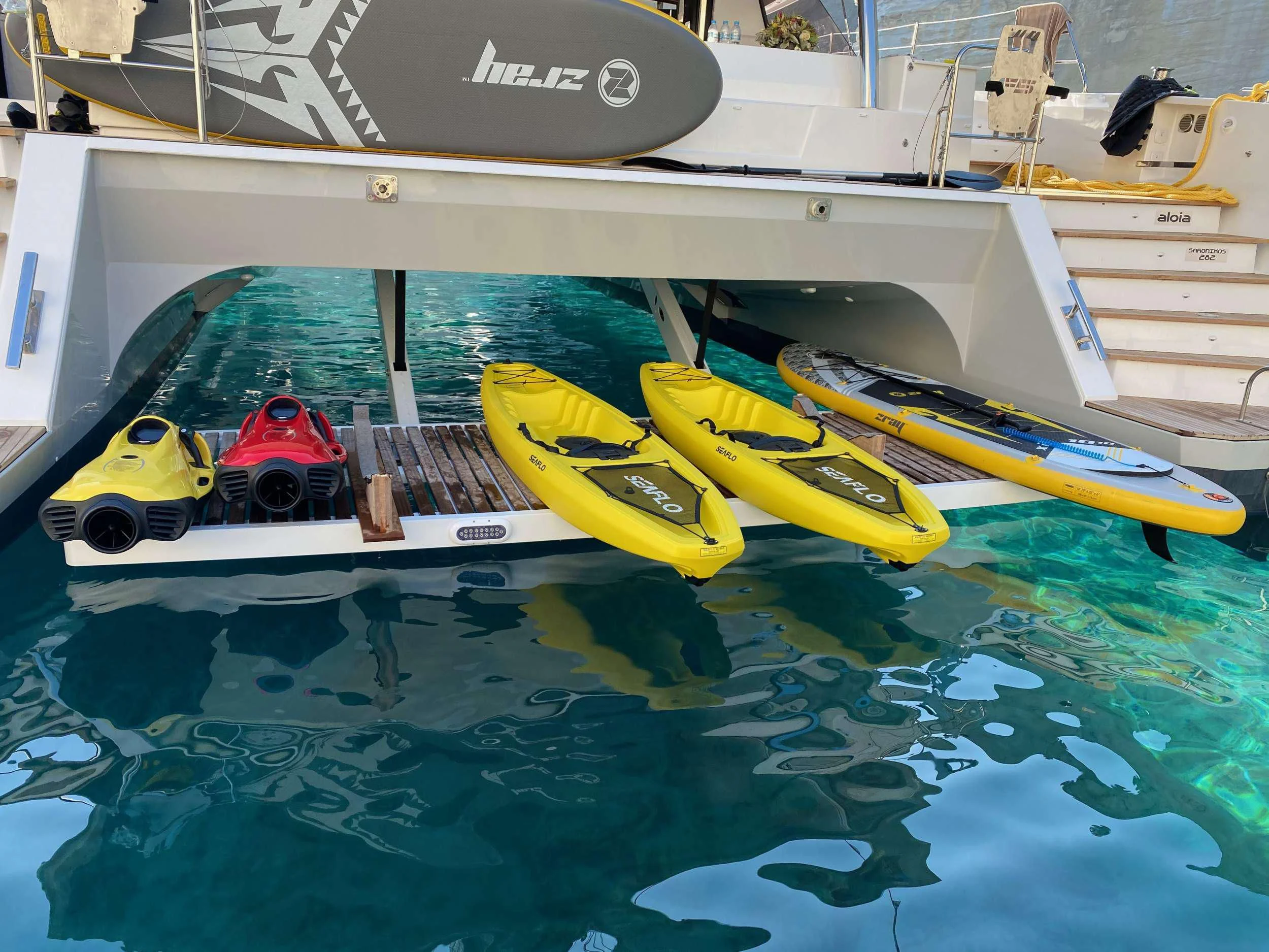 a group of kayaks in a pool aboard ALOIA Yacht for Charter