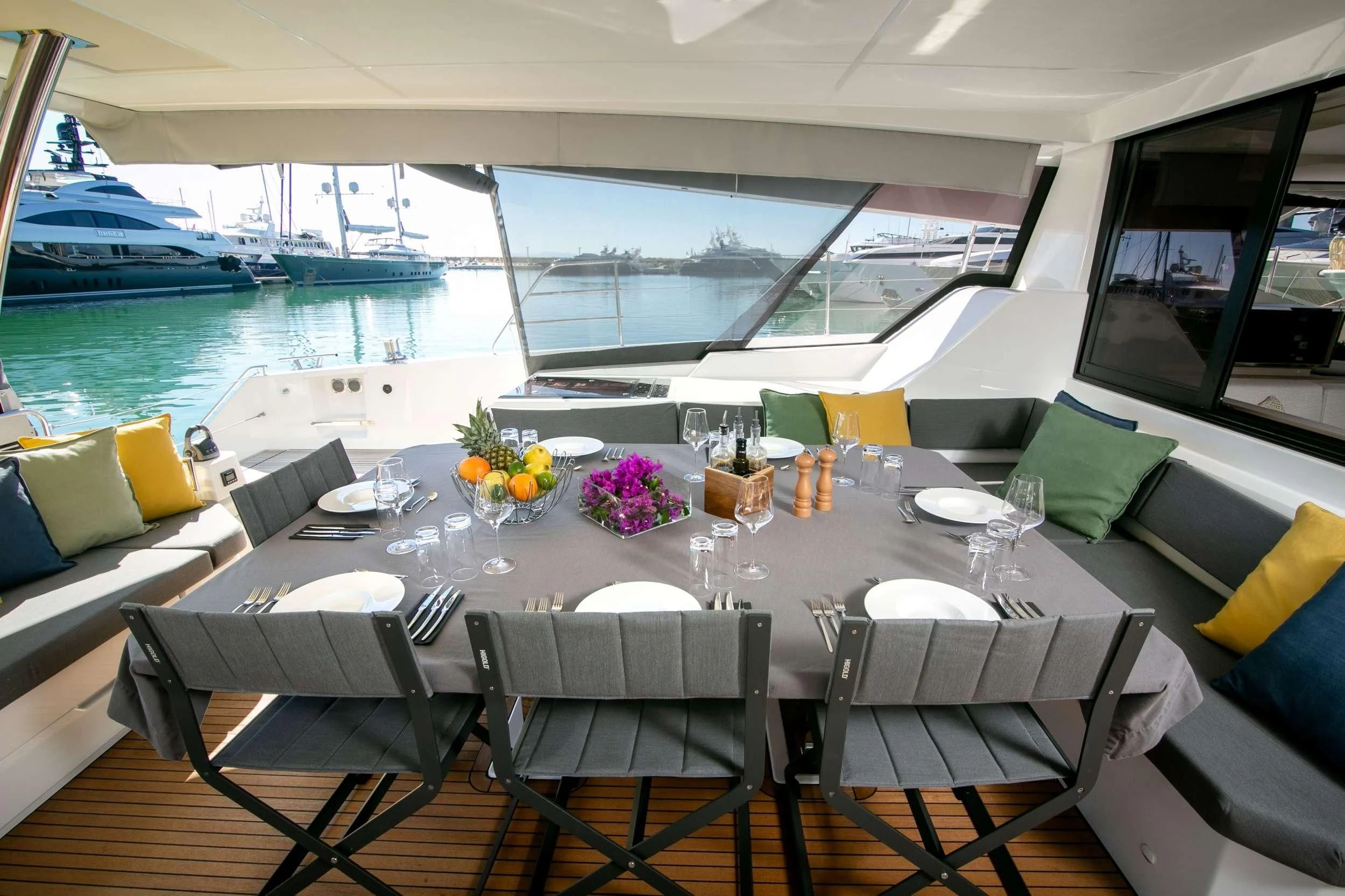 a table set for a meal on a boat aboard ALOIA Yacht for Charter