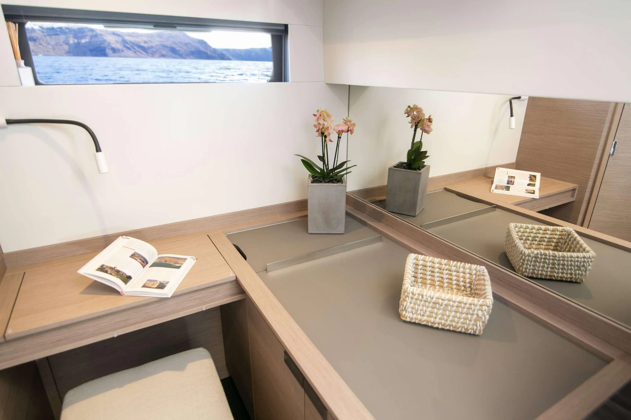 a counter with a plant and a window aboard ALOIA Yacht for Charter