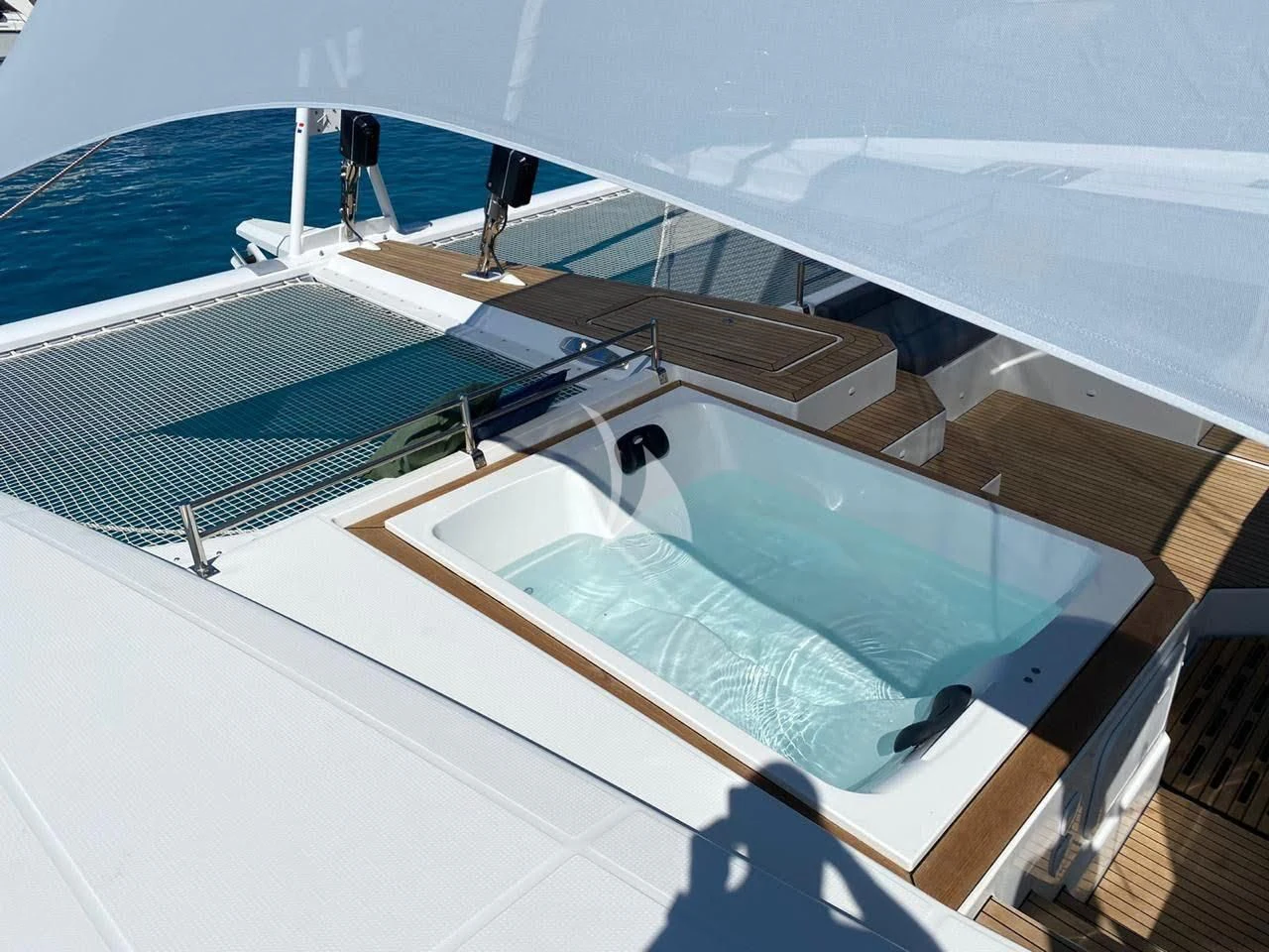 a large swimming pool aboard ALOIA Yacht for Charter