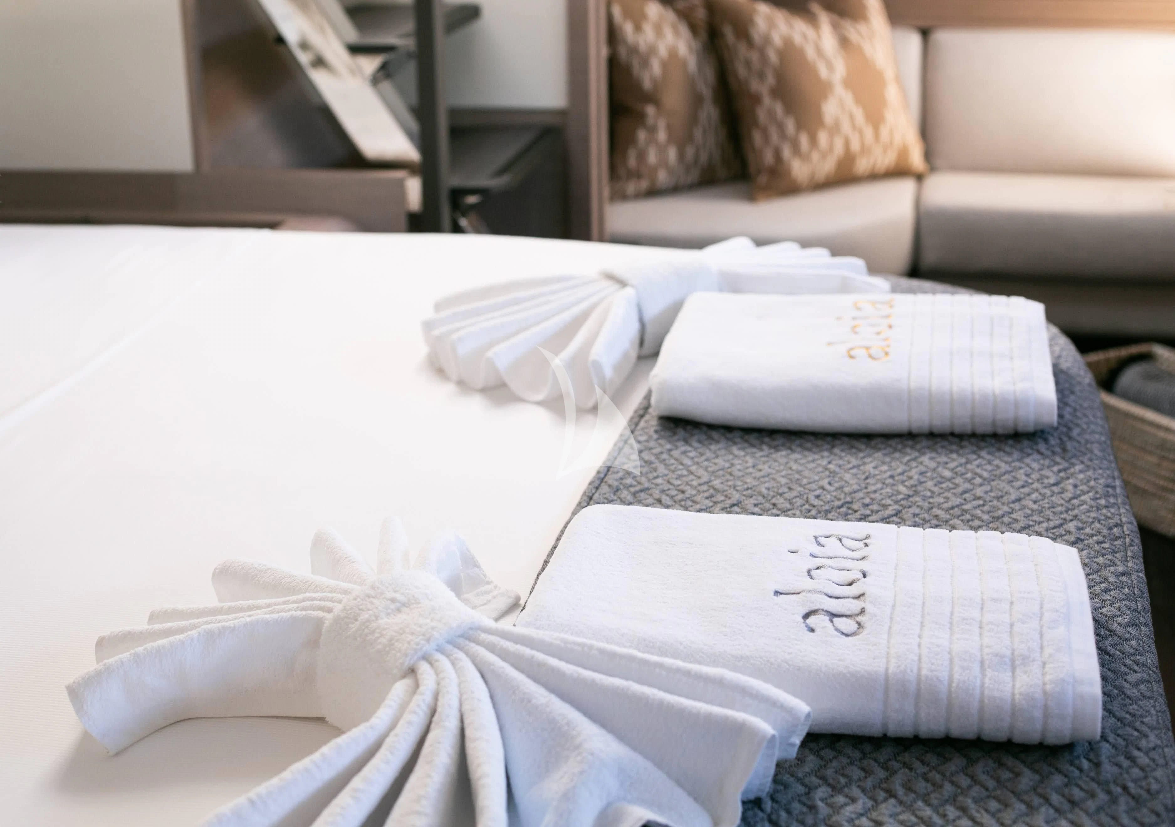 a pair of towels on a bed aboard ALOIA Yacht for Charter
