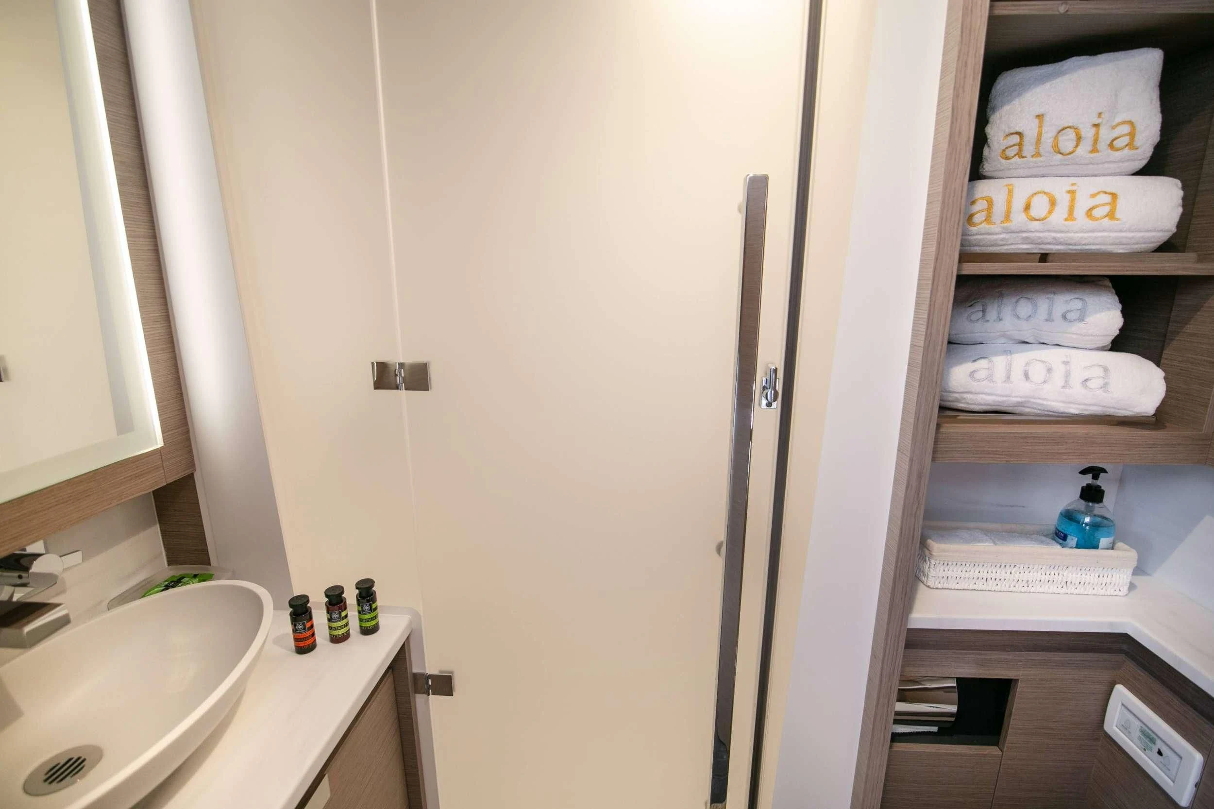 a white door with a white object on it aboard ALOIA Yacht for Charter
