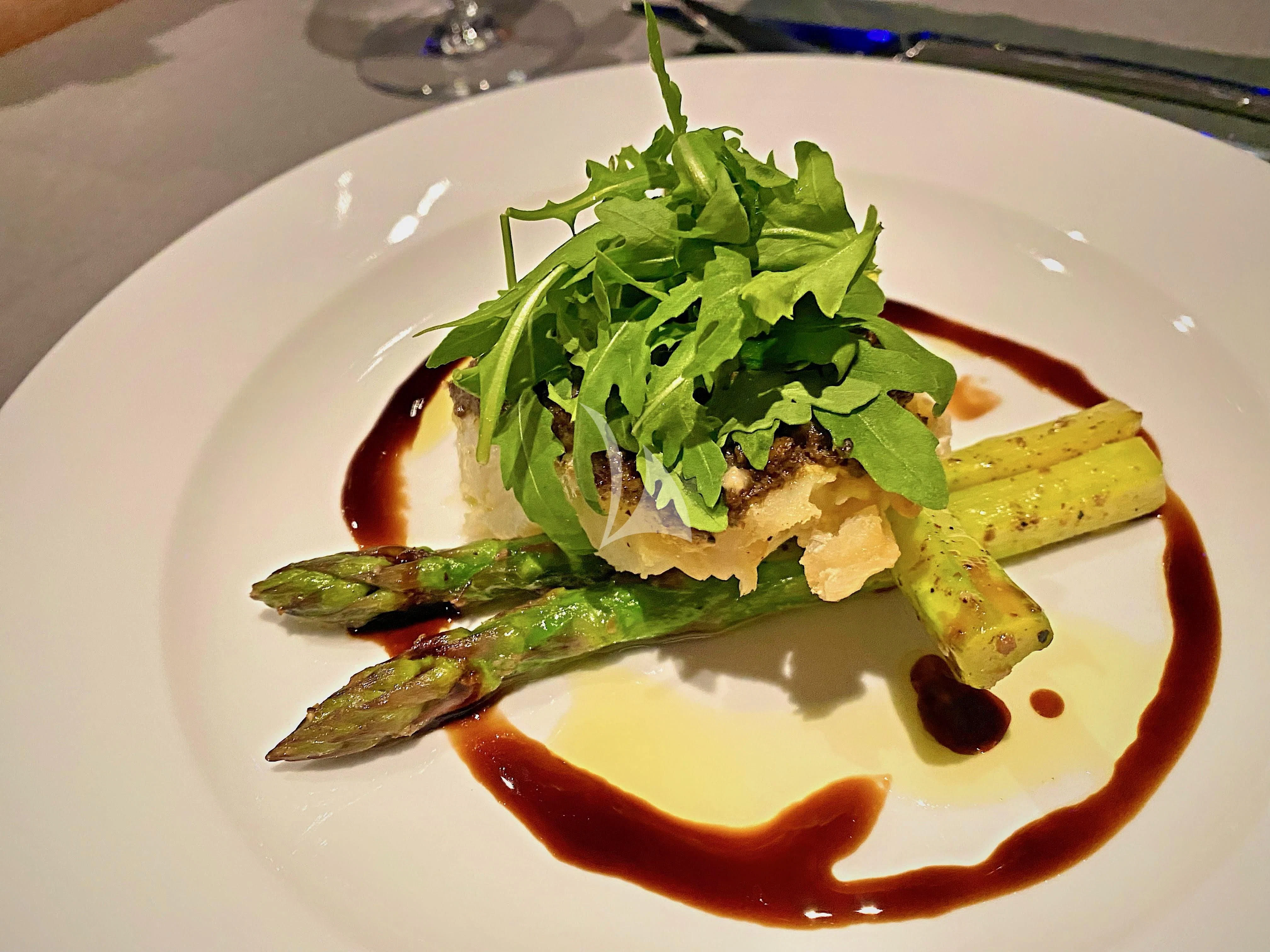 a plate of food aboard ALOIA Yacht for Charter