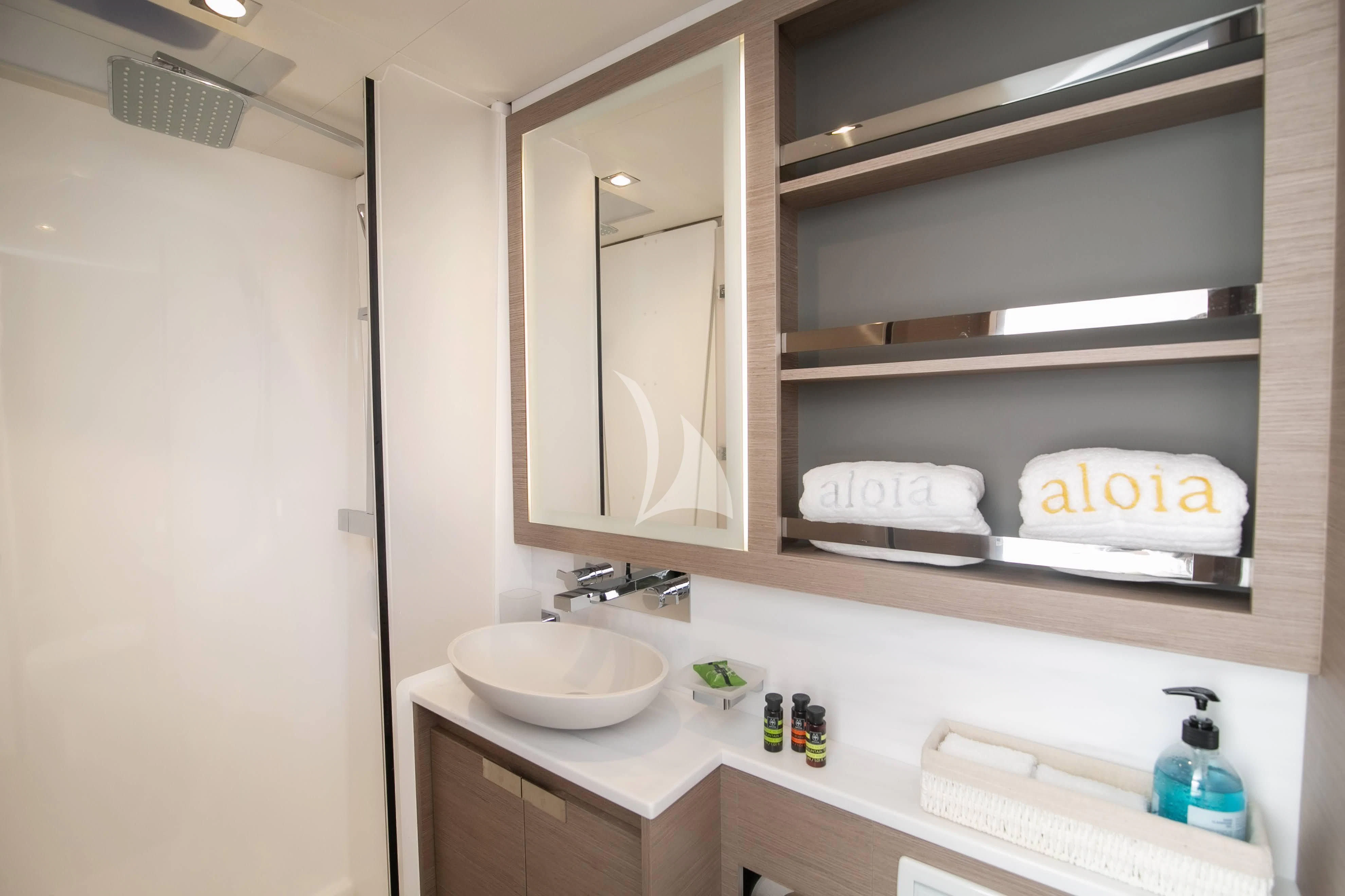 a bathroom with a sink and a mirror aboard ALOIA Yacht for Charter