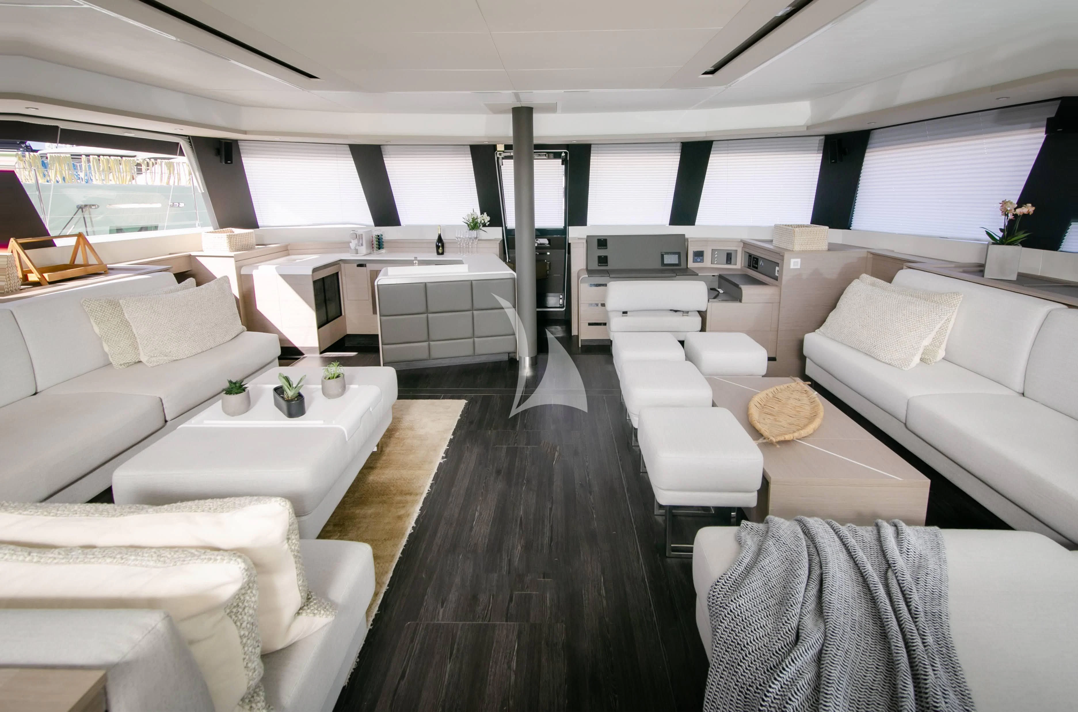 a room with a couch and a table aboard ALOIA Yacht for Charter
