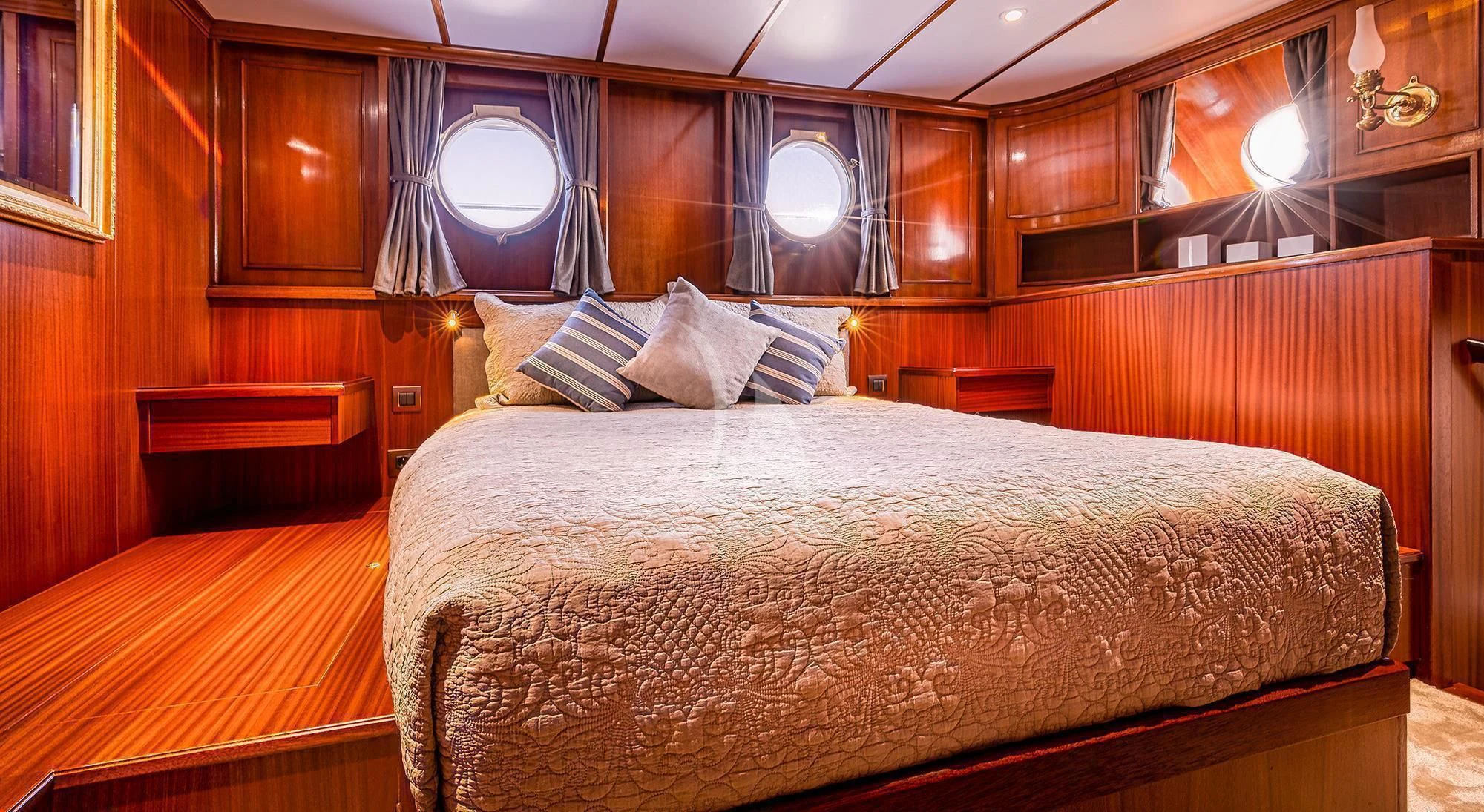 a large bed in a room aboard CHANTELLA Yacht for Sale