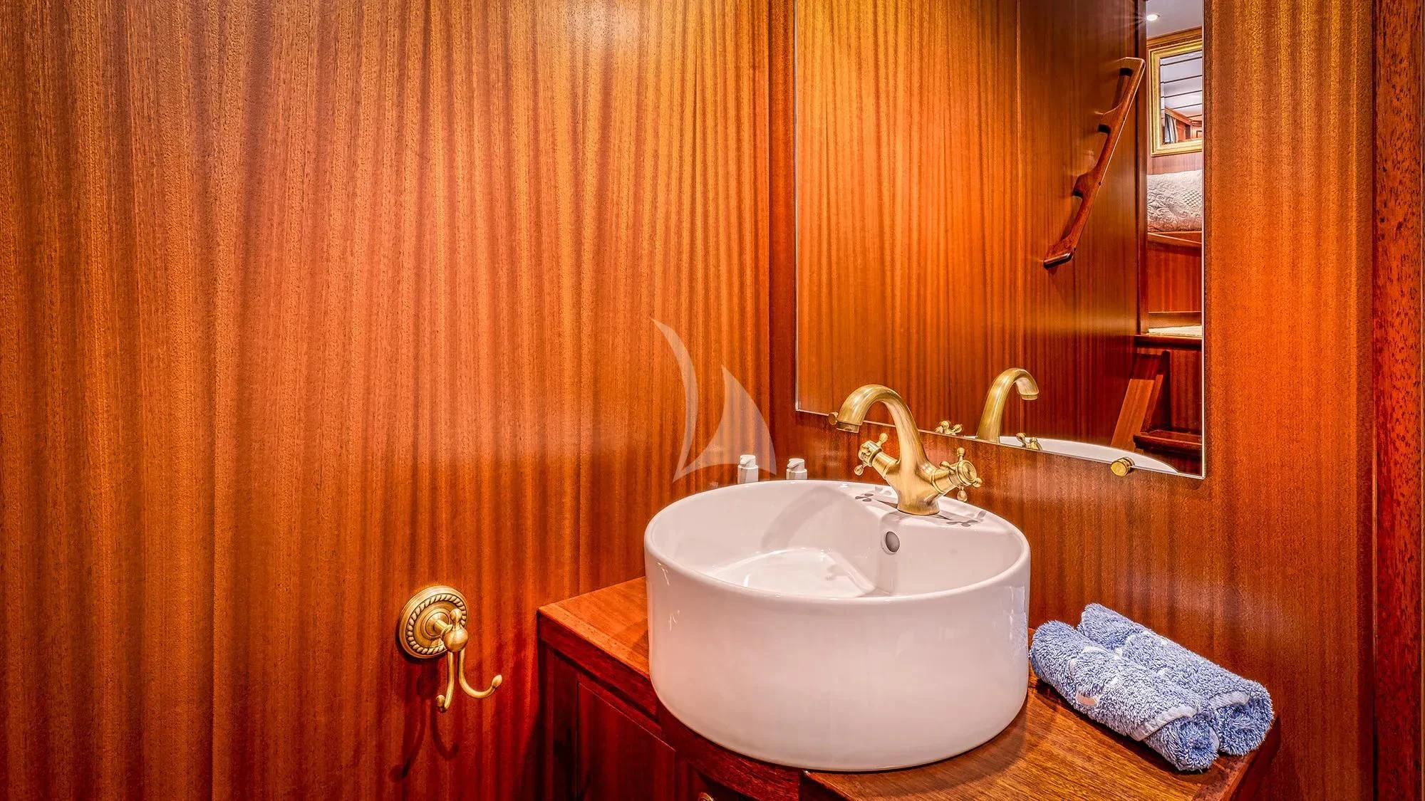 a bathroom with a sink and a mirror aboard CHANTELLA Yacht for Sale