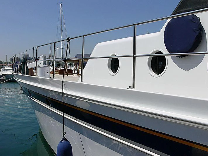 a white boat with blue and black goggles aboard CHANTELLA Yacht for Sale