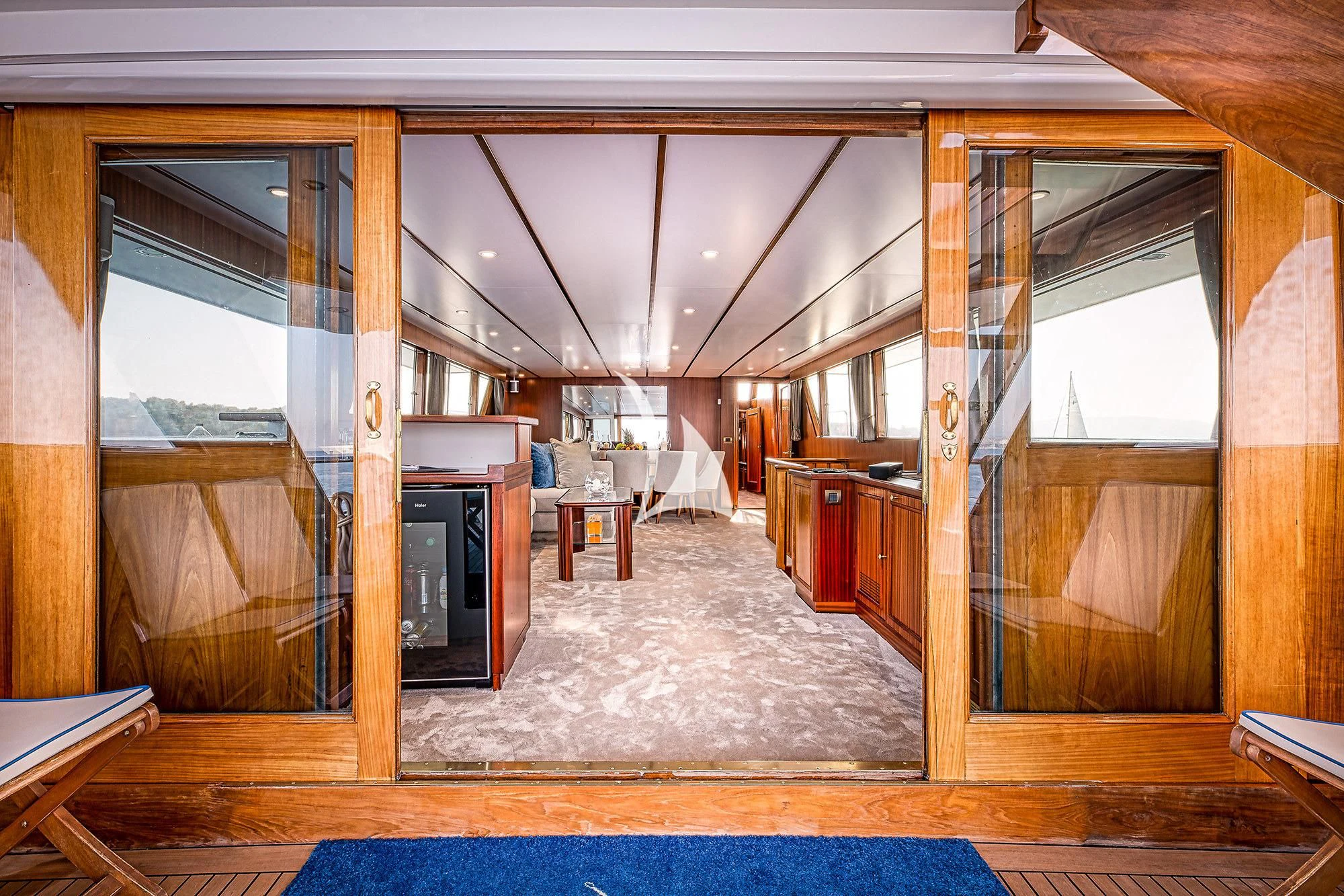 a room with a fireplace and a wood floor aboard CHANTELLA Yacht for Sale