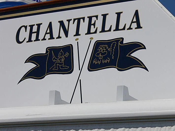a sign with a fish and a fish on it aboard CHANTELLA Yacht for Sale