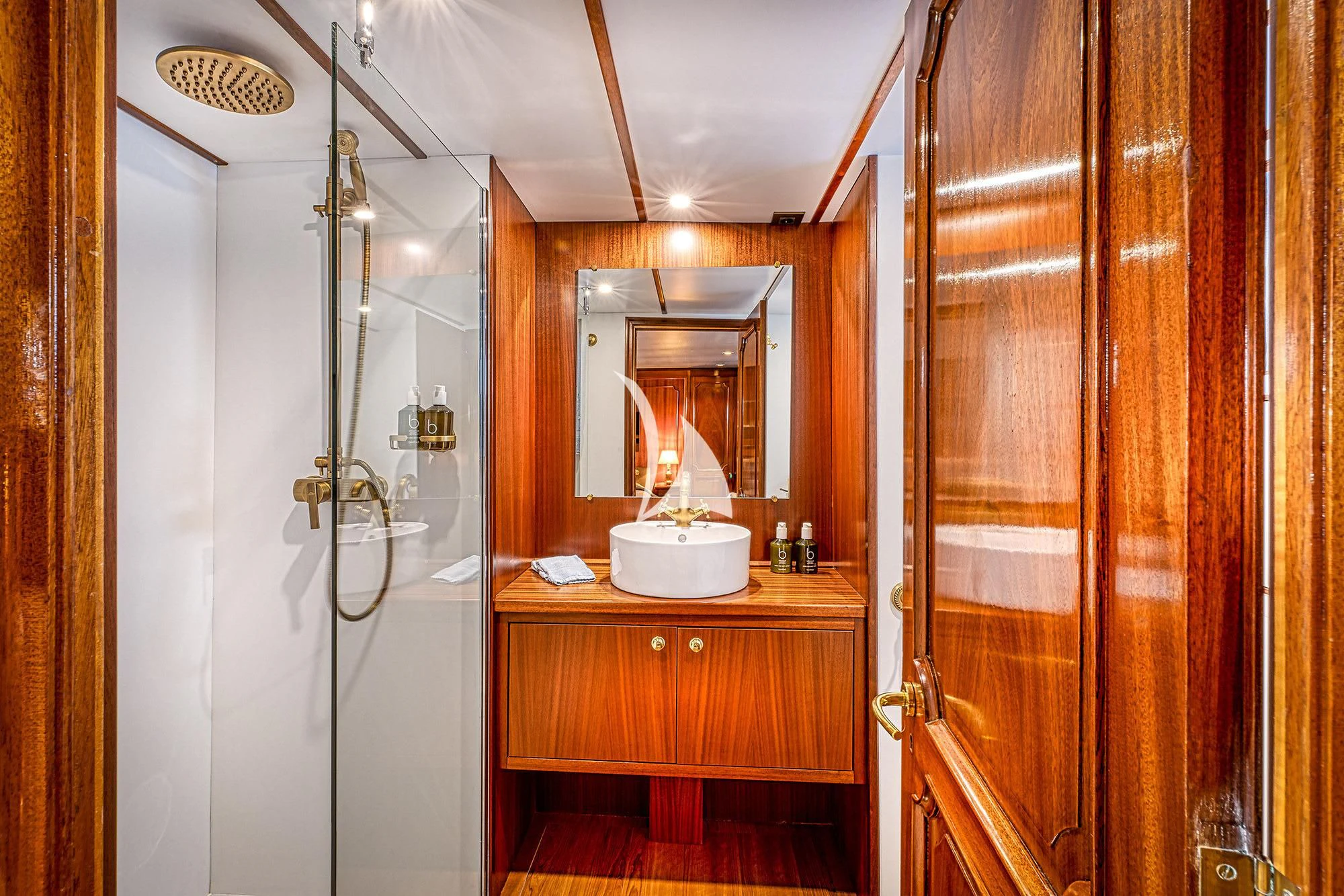 a bathroom with a shower unit and sink aboard CHANTELLA Yacht for Sale