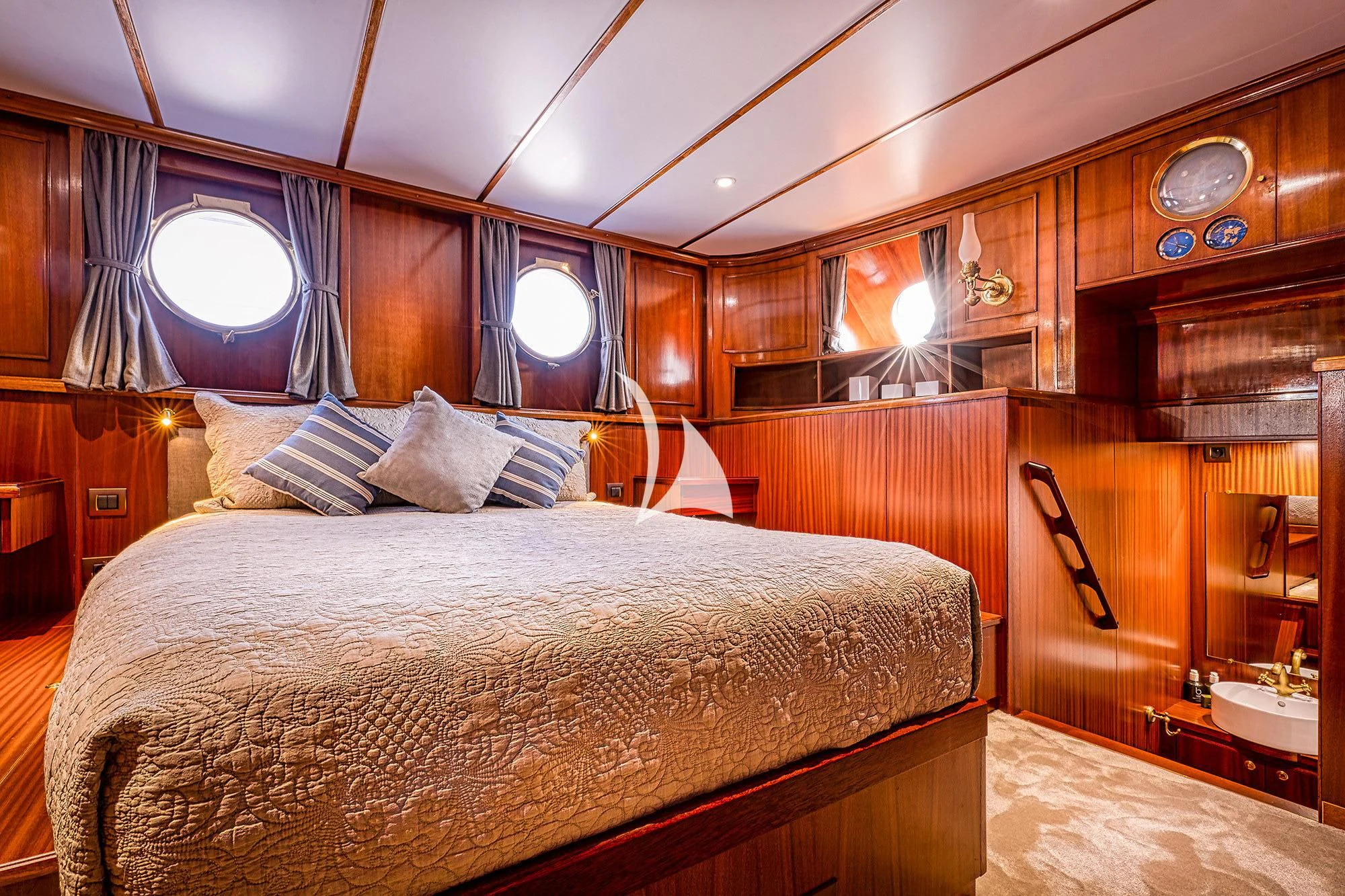 a bed with a large bed aboard CHANTELLA Yacht for Sale
