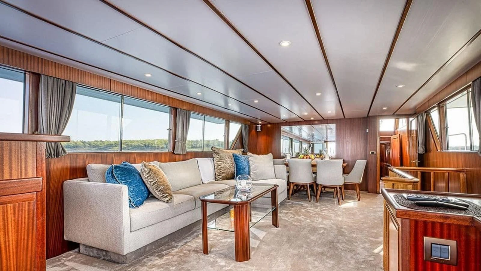 a living room with a couch and a table aboard CHANTELLA Yacht for Sale