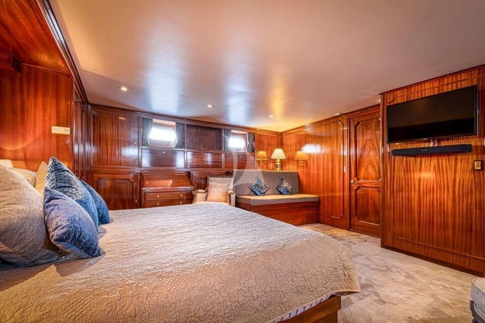 a large bed in a room aboard CHANTELLA Yacht for Sale
