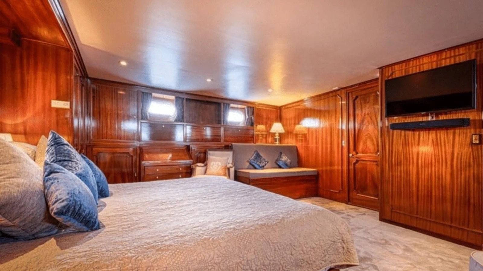 a large bed in a room aboard CHANTELLA Yacht for Sale